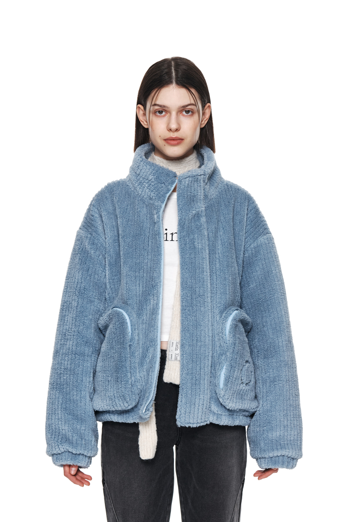 OUT POCKET FUZZY PUFFER JUMPER IN SKY